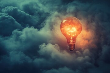 Illuminated Light Bulb Amidst Clouds