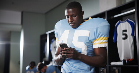 Football, phone and reading with man in locker room for rookie drafting, pro league research and contact. Game score update, team roster with person for connection, training schedule and player stats