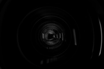 Close-up macro lens,Photo or video camera lens with light reflections close-up on the black background.