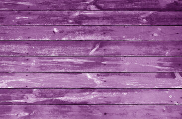 Weathered violet stained wood plank or board floor.