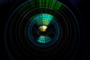Close-up macro lens,Photo or video camera lens with light reflections close-up on the black background.