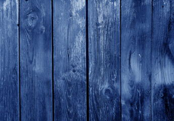 Grungy blue weathered wooden board wall.