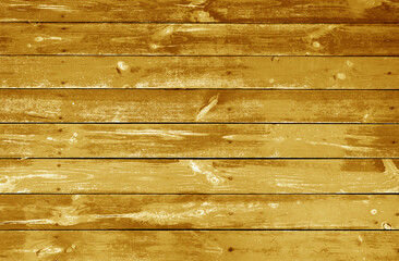 Weathered orange stained wood plank or board floor.