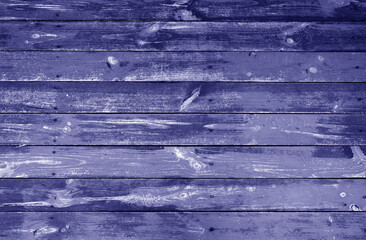 Weathered blue stained wood plank or board floor.