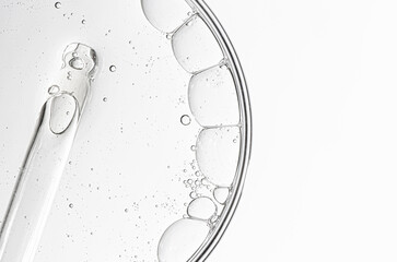 Cosmetic moisturizing gel or skin serum in a petri dish. Copy space