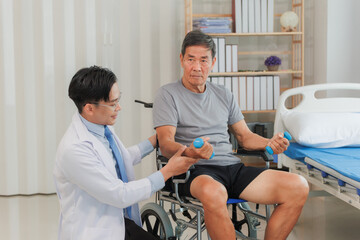 Fototapeta premium Patient with weak arm muscles doing light dumbbell exercises during physical therapy to regain strength and support physical recovery.