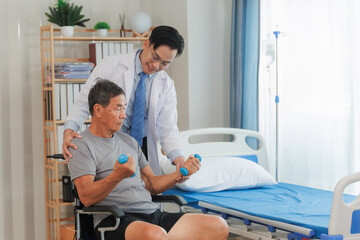 Fototapeta premium Patient with weak arm muscles doing light dumbbell exercises during physical therapy to regain strength and support physical recovery.