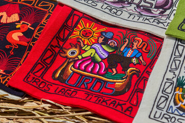 Traditional embroidery created by Uros artisans on the floating islands of Lake Titicaca, Puno, Peru. Rich in vibrant colors and symbolic motifs.