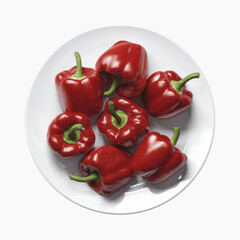 Overhead View of Seven Red Bell Peppers on a White Plate