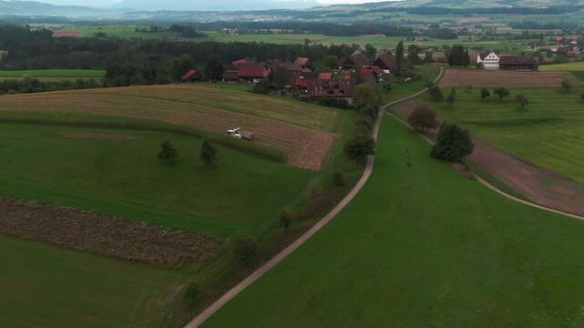 Drone Footage of Corn Harvest with Tractors and Agricultural Machinery &ndash; Aerial View of Modern Farming