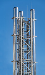 large industrial shiny metal pipes