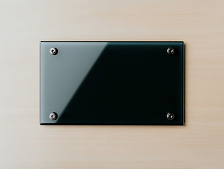 Obraz premium Elegant glass sign on a wooden wall, reflecting light. Securely mounted with four metal screws. Minimalist design, perfect for office or retail spaces.