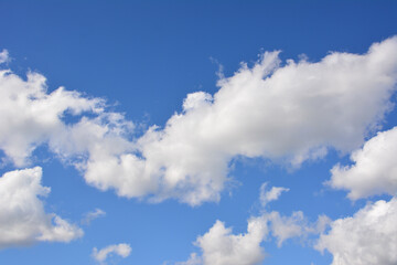 Beautiful blue sky with white fluffy clouds
