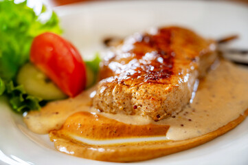 Pork steak in spicy mustard sauce.