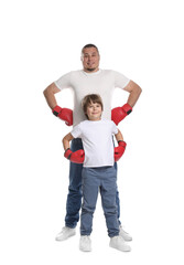 Father and his son in boxing gloves on white background