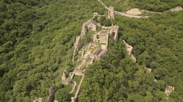 Aerial fly over view Ujarma Fortress. Ancient Hilltop Royal Citadel and Strategic Stronghold of the Iberian Kings in Kakheti, Georgia. Sightseeing destination in Kakheti wine region