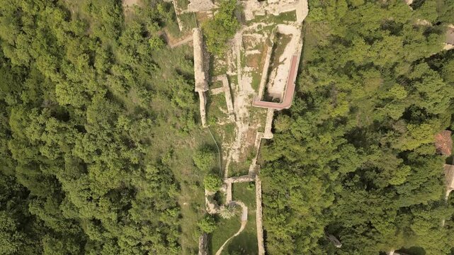 Aerial top down fly over view Ujarma Fortress ruins. Ancient Hilltop Royal Citadel and Strategic Stronghold of the Iberian Kings in Kakheti, Georgia. Sightseeing destination in Kakheti wine region