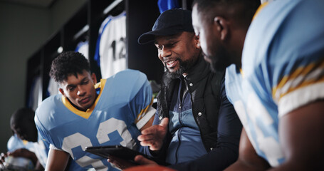 Tablet, coaching and football team with men in locker room for game plan, sports strategy or...