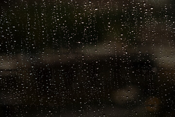 Window with raindrops, traces of rain on the window