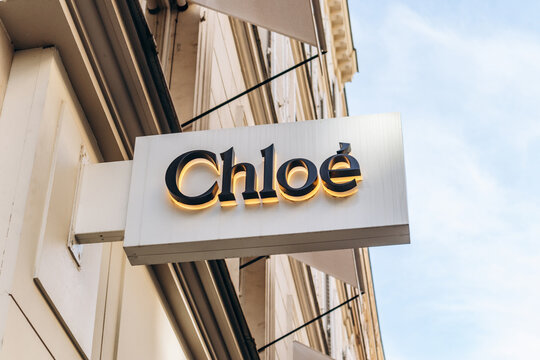 Paris, France - 23 February 2025: Chlo&eacute; boutique sign with black letters and gold backlighting on white facade, rue Saint-Honor&eacute;
