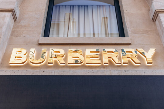 Paris, France - 23 February 2025: Burberry boutique sign on rue Saint Honore, iconic British fashion logo on modern check-patterned facade, luxury flagship store exterior