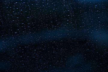 Window with raindrops, traces of rain on the window