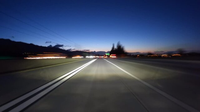Dawn driving motion blur time lapse on the 210 freeway through Pasadena in Los Angeles County California.