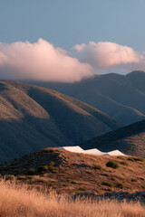 solar energy farm in spain enveloped in morning fog showcasing smooth lines and dramatic contrasts of light and