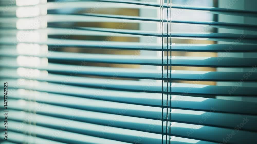 Poster A detailed view of a window with closed blinds, suitable for interior design or architecture projects