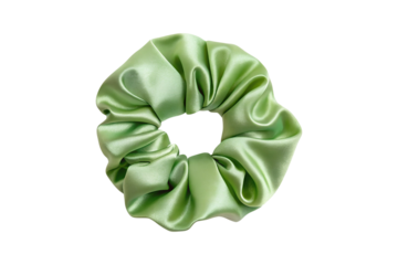Green silky scrunchie hair tie elegantly displayed on a solid backdrop transparent background