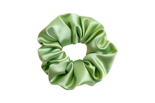 Green silky scrunchie hair tie elegantly displayed on a solid backdrop transparent background