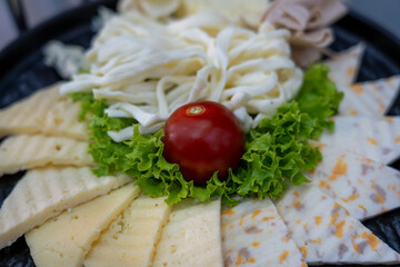 Cheese platter and cherry tomato