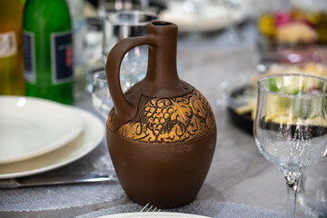 Clay wine jug on banquet table