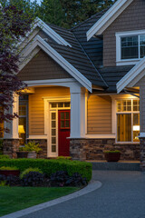 Entrance of luxury house with nice spring blossom landscape at night in Vancouver, Canada, North America. April 2025.