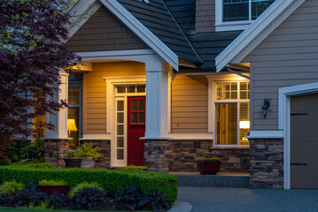 Entrance of luxury house with nice spring blossom landscape at night in Vancouver, Canada, North America. April 2025.