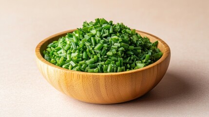 Freshly chopped chives in a wooden bowl