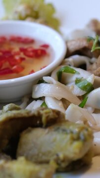 rice vermicelli with soy salad and chili fish sauce vietnamese asian food on white plate