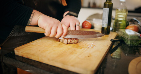 Hands, knife and steak with person in kitchen for food, diet and meal prep and cooking. Nutrition,...