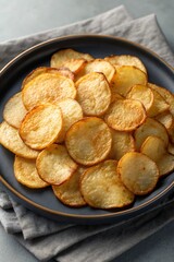 Fried potato slices on white &ndash; crunchy snack food image