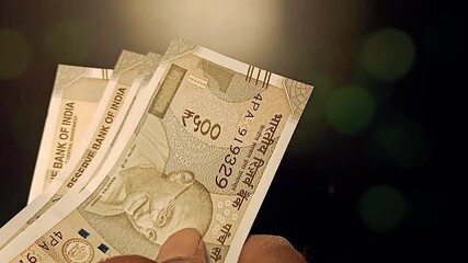 A person counts Indian 500 rupee currency bank note