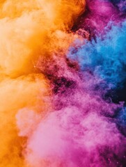 Fototapeta premium Colorful smoke explosion abstract background overhead shot with orange pink and blue hues for design projects
