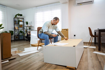 Man assembling furniture in a bright modern living space