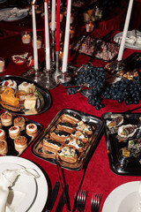 Assorted elegant canapés and hors d’oeuvres on metal trays, featuring seafood, vegetables, and savory pastries — perfect for upscale events.
