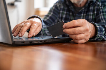 Senior man shopping or banking online