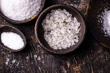 Natural sea salt crystals on dark background