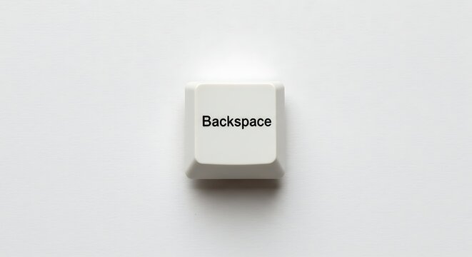 Close up of a white backspace key on a keyboard