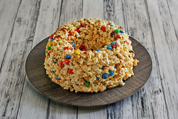 sweet popcorn cake with mixed nuts and chocolate candy