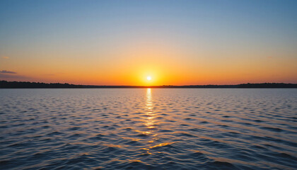 Obraz premium Serene sunset over calm lake water landscape