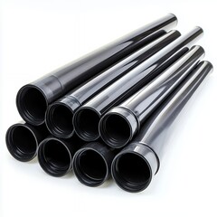 Fototapeta premium Stack of Black Cylindrical Tubes on White Background