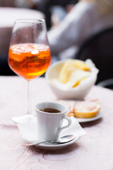 Refreshing drink and coffee with snacks at a cafe table